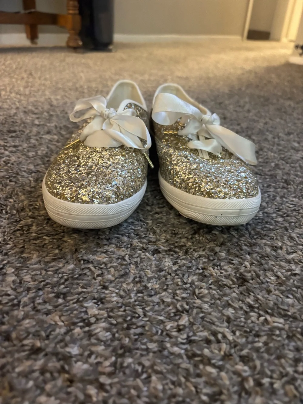kate spade women’s Gold Glitter Sneakers with Satin Bow